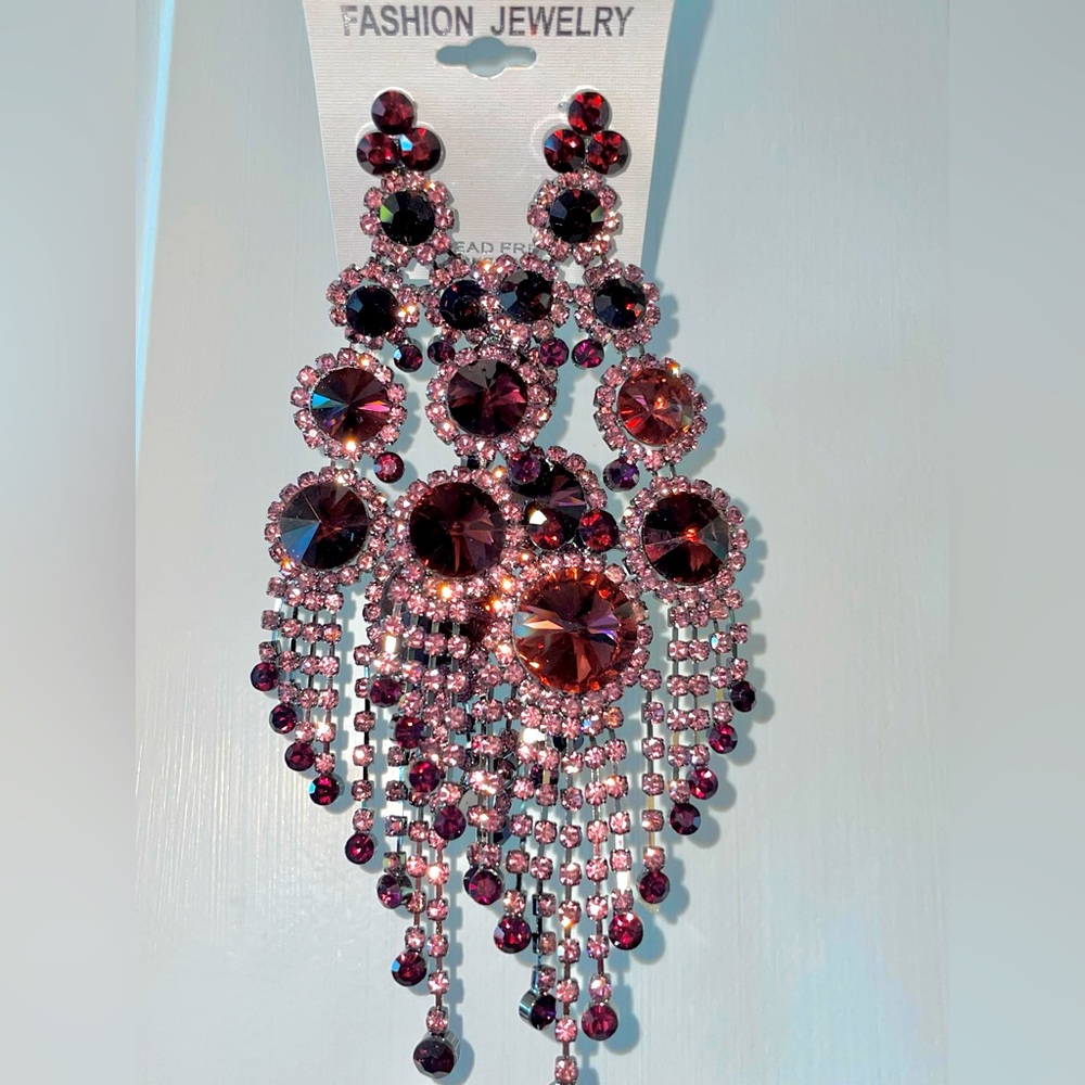 NOT FOR SALE Purple Pageant earrings- clip in style. New in bag. Never worn.